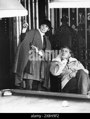 SHIRLEY RUSSELL and her husband KEN RUSSELL photographed in the billiards room of Elvaston Castle near Derby during the filming of WOMEN IN LOVE 1969 Director KEN RUSSELL Novel D. H. LAWRENCE Screenplay LARRY KRAMER Costume Designer SHIRLEY RUSSELL Brandywine Productions / United Artists Stock Photo