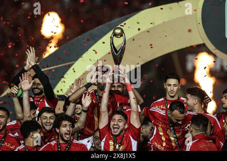 Cairo, Egypt. 25th May, 2024. Players of Al Ahly lift the trophy to celebrate after winning the final match between Al Ahly of Egypt and ES Tunis of Tunisia at the CAF Champions League 2024 in Cairo, Egypt, on May 25, 2024. Credit: Ahmed Gomaa/Xinhua/Alamy Live News Stock Photo