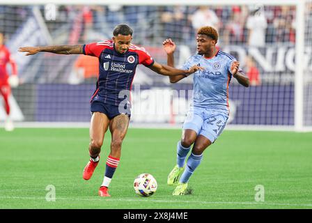 May 25, 2024; Foxborough, MA, USA; New England Revolution midfielder Dylan Borrero (11) and New York City defender Tayvon Gray (24) in action during the MLS match between New York City FC and New England Revolution. Anthony Nesmith/CSM Stock Photo