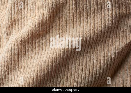 light brown color soft corduroy fabric surface background texture, abstract of cotton material for pants, jackets, skirts with attractive style Stock Photo