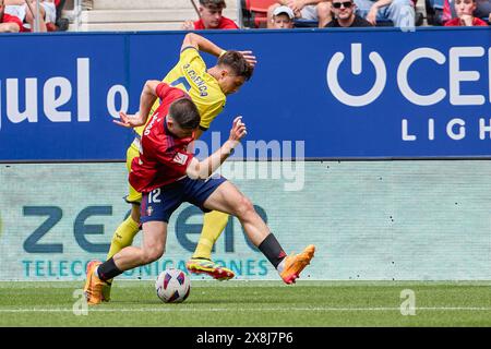 Pamplona, Spain. 25th May, 2024. Jesús Areso of CA Osasuna and Jorge Cuenca Barreno of Villarreal CF seen in action during the Spanish football of the league EA, match between CA Osasuna and Villarreal CF at the Sadar Stadium. Final scores; CA Osasuna 1:1 Villarreal CF. (Photo by Fernando Pidal/SOPA Images/Sipa USA) Credit: Sipa USA/Alamy Live News Stock Photo