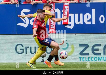 Pamplona, Spain. 25th May, 2024. Jesús Areso of CA Osasuna and Jorge Cuenca Barreno of Villarreal CF seen in action during the Spanish football of the league EA, match between CA Osasuna and Villarreal CF at the Sadar Stadium. Final scores; CA Osasuna 1:1 Villarreal CF. (Photo by Fernando Pidal/SOPA Images/Sipa USA) Credit: Sipa USA/Alamy Live News Stock Photo