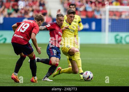 Pamplona, Spain. 25th May, 2024. Rubén Peña of CA Osasuna and Jorge Cuenca Barreno of Villarreal CF seen in action during the Spanish football of the league EA, match between CA Osasuna and Villarreal CF at the Sadar Stadium. Final scores; CA Osasuna 1:1 Villarreal CF. (Photo by Fernando Pidal/SOPA Images/Sipa USA) Credit: Sipa USA/Alamy Live News Stock Photo