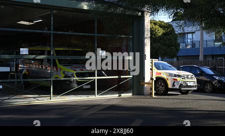 Ambulance Victoria depot or station featuring two paramedic vehicles parked, a sheltered Mercedes Benz Sprinter and a Toyota Kluger outside Stock Photo