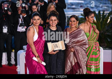 Cannes, France. 25th May, 2024. Kani Kusruti, Chhaya Kadam, Payal Kapadia, and Divya Prabha are posing with the Grand Prix Award for 'All We Imagine As Light' at the Palme D'Or Winners Photocall at the 77th annual Cannes Film Festival at Palais des Festivals in Cannes, France, on May 25, 2024. (Photo by Stefanos Kyriazis/NurPhoto) Credit: NurPhoto SRL/Alamy Live News Stock Photo