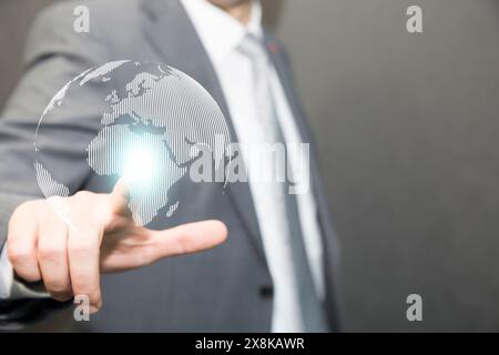 Hand touching virtual world with connection network. Global data information and technology exchange. Stock Photo
