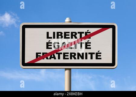 A French exit city sign against a blue sky with written in the middle in French 'Liberté, Égalité, Fraternité', meaning in English 'Liberty, Equality, Stock Photo