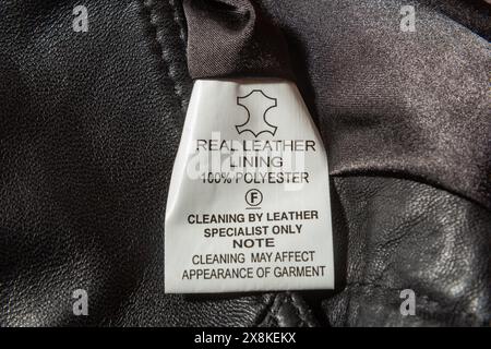 real leather written on label on leather waistcoat Stock Photo