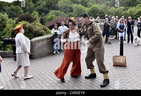 Ironbridge, Telford, UK. 26th May, 2024. World War Two weekend in the Ironbridge, Shropshire. Visitors dancing in the street dressed in 1940s style clothing. Credit: Dave Bagnall /Alamy Live News Stock Photo