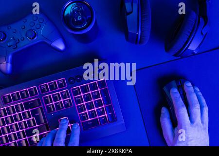 Hands using keyboard with mouse while gaming Stock Photo