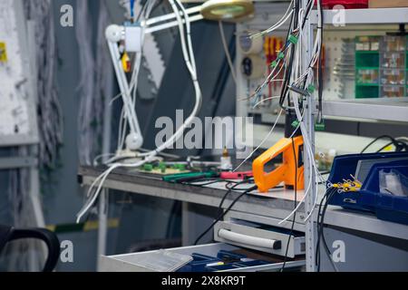 Perm, Russia - May 23, 2024: workplace of assembler of electrical equipment in a factory Stock Photo