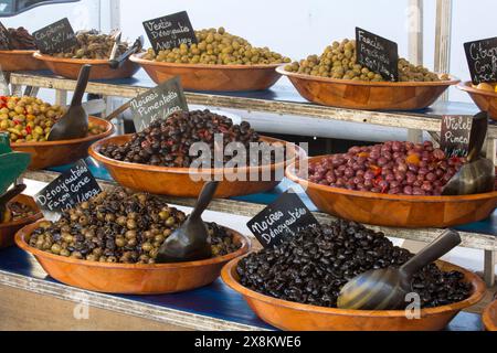 Ajaccio, Corse-du-Sud, Corsica, France. Wide-ranging selection of olives for sale at traditional open-air farmers' market in Place Foch. Stock Photo