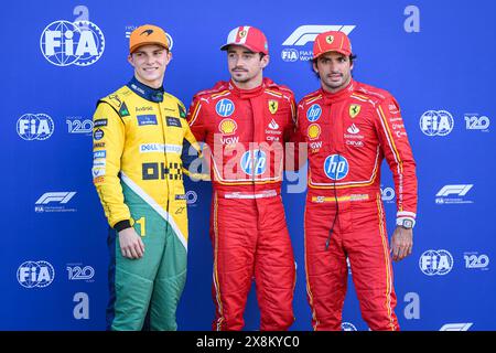 (from L) McLaren Formula 1 Team’s Australian driver Oscar Piastri, Scuderia Ferrari’s Monegasque driver Charles Leclerc and Scuderia Ferrari’s Spanish driver Carlos Sainz pose for photos after the qualifying session of the Monaco F1 Grand Prix. Stock Photo