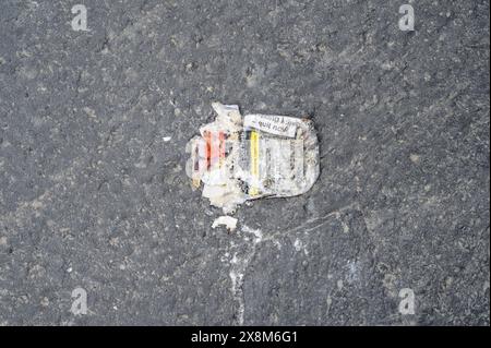 A discarded cigarette packet on a pavement Stock Photo