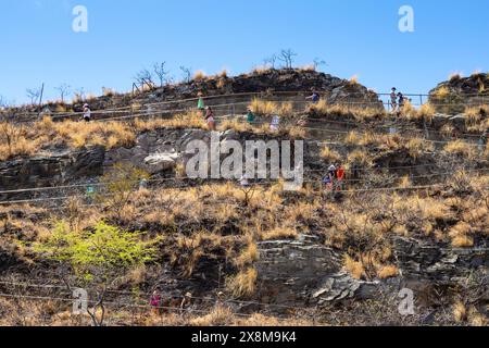 HONOLULU, HAWAII - AUG. 21, 2023: Tourists hiking up the pathway to the summit at Diamond Head State Monument on Oahu in Honolulu, Hawaii. A national Stock Photo