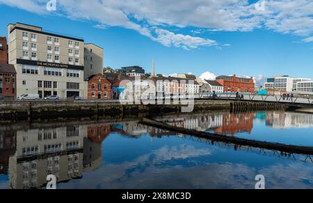 Colorful buildings reflected on river lee. Cork city Ireland Stock Photo