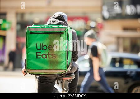 Manchester Oxford Road corridor Uber Eats delivery cyclist Stock Photo