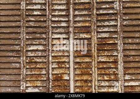 A detailed view of a rusty train track with visible metal texture and corrosion. Stock Photo