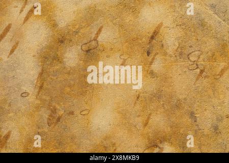 A piece of paper with handwritten text on a textured surface, creating an abstract and intricate design. Stock Photo