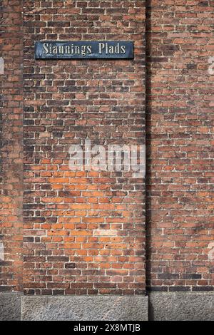 Staunings Plads, street sign on red brick wall; Copenhagen, Denmark Stock Photo