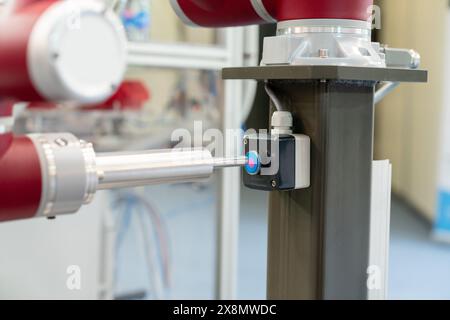 Industrial Robot presses the button. Accuracy calibration Stock Photo ...