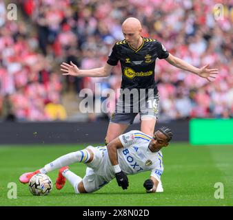 London, UK. 26th May, 2024. Southampton's Will Smallbone (back) battles with Leeds United's Crysencio Summerville (front) during the Championship Play-Off Final between Leeds United and Southampton at Wembley Stadium in London, England. (David Horton/SPP) Credit: SPP Sport Press Photo. /Alamy Live News Stock Photo