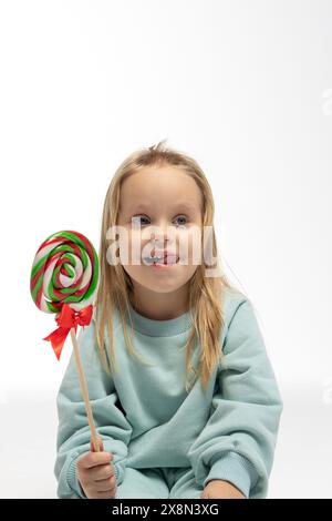 Child eating lollipop. High quality photo Stock Photo - Alamy