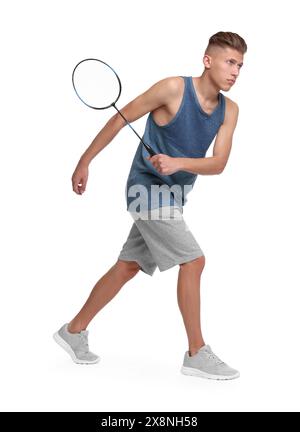 Young man playing badminton with racket on white background Stock Photo