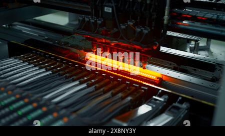 Electronic circuit boards production and installation of SMD components. Creative. Needle automatic equipment diagnose and test chips and processors. Stock Photo