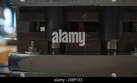 Industrial Press with Aluminum line. Creative. Pressing and making holes on thin metal line. Press machines with aluminum line in metallurgical Stock Photo