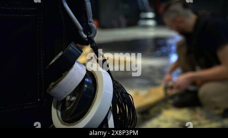 Carpenters using professional equipment at the workshop. Media. Working with wooden beams. Stock Photo