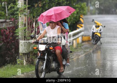 Laguna, Calabarzon, Philippines. May 26,2024: Announced as severe tropical depression, first storm to hit the archipelago this year Aghon (Ewiniar) surprised Filipinos by its devastating intensity : flooding, house destructions, power & water  cuts expected to last days, tree falls, hundreds of rescued & families in evacuation centers... Reclassified as typhoon, gov released P1.2M of humanitarian aid to victims & prepared P3 billion of standby funds. In few hours, the country went from months-long heat records & extreme drought to torrential rains & floods. Credit: Kevin Izorce/Alamy Live News Stock Photo