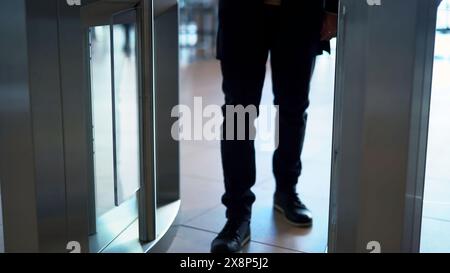 Man passing through the security gates. Media. Man using turnstile to enter the shopping center or subway. Stock Photo