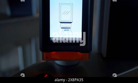 Close up of electronic turnstile with plastic card entering system. Media. Using smartphone with barcode, access control equipment. Stock Photo