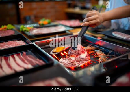 Shabu and Grill is famous Japanese food. Contains seafood, pork, chicken, beef and vegetables. Stock Photo