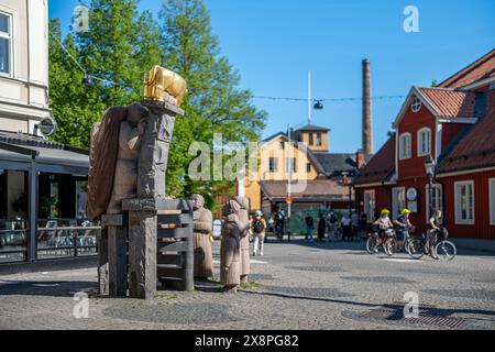 Skvallertorget or Gossip square with a granite sculpture by Pye Engström in Norrköping during spring in Sweden. Stock Photo