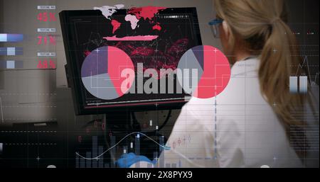 The rear view of a doctor looking at a dna molecule on a computer in a hospital is shown Stock Photo