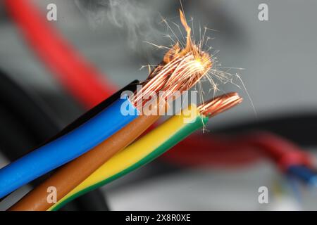 Sparking wiring on blurred background, closeup view Stock Photo