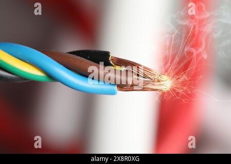 Sparking wiring on blurred background, closeup view Stock Photo