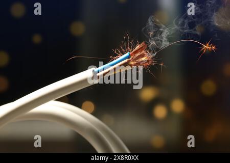 Sparking wiring on blurred background, closeup view Stock Photo