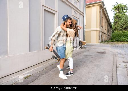 Couple goals. Simple living. Freedom as lifestyle. Young couple enjoying outdoor and sunset. Having fun on nice weather. Man and woman, hipsters, gene Stock Photo