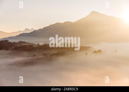 Misty sunrise over KitzbÃ¼heler Horn, KitzbÃ¼heler Alps, Tyrol, Austria Stock Photo