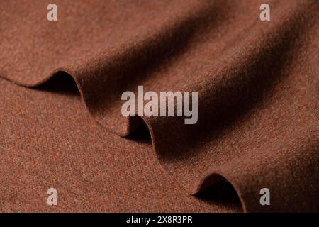 Close-up of folded red brown fabric with soft texture Stock Photo