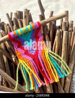 Twigs and a Mini Rainbow Macrame Wall Hanging Stock Photo