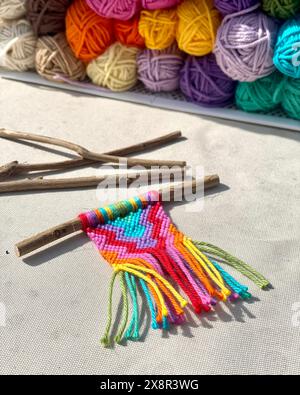 Colorful Thread Skeins and a Mini Macrame Wall Hanging Stock Photo