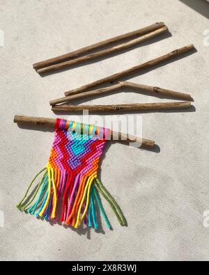 Colorful Mini Macrame Hangings on Twig Rods Stock Photo