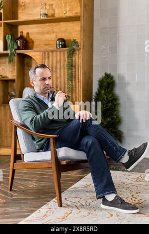 male psychologist expert sitting in cabinet listening Stock Photo