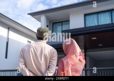 Young couple looking at their new house Stock Photo
