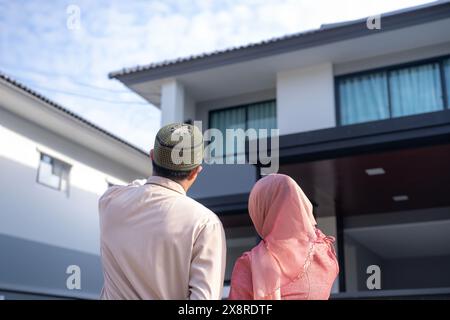 Young couple looking at their new house Stock Photo