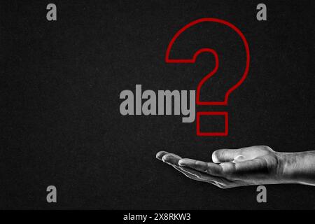 Hand in Black and White with Red Question Mark, Copy Space Stock Photo